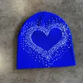 Macro detail of royal blue knit beanie featuring a white heart pattern and soft texture - M (52-59) / Sapphire Blue