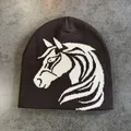Close-up detail of knitted brown beanie featuring a white horse jacquard pattern - M (52-59) / Coffee