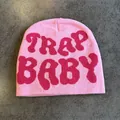 Detailed close-up of pink knitted beanie featuring Trap Baby jacquard pattern texture - Rose Pink