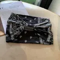 Vintage black paisley elastic wide headband featuring a stylish bow knot design - Black