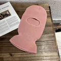 Close-up of pink ribbed knit balaclava mask showing soft texture and elastic material - Pink