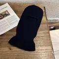 Close-up of a navy blue ribbed knit balaclava face mask on a wooden surface - Navy Blue