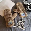 Detail of plush lamb wool mittens in brown featuring a cute koala patch and neck string - Khaki