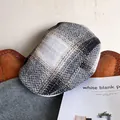 Detail of British herringbone tweed newsboy hat with vintage plaid fabric texture - Adjustable / Black