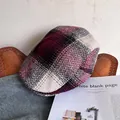 Detail of red and black herringbone tweed plaid ivy cap with retro British style texture - Adjustable / Burgundy