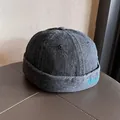 Detail of black denim skullcap showing the blue Magic embroidery and washed texture - Adjustable / Black