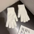 Detailed close-up of soft white faux mink fur gloves with knitted ribbed cuffs for winter - White