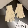 Detail view of cream plush knit gloves with soft faux mink texture and elastic cuffs - Beige