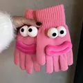 Detail of pink knitted gloves with funny 3D cartoon eyes and thick lips character design - Rose Pink