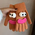 Detail of knitted orange-brown glove with 3D cartoon eyes and plush pink lips decor - Orange