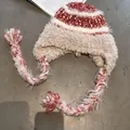 Winter striped plush knit trapper hat with warm earflaps and braided tassels in beige red - M (55-59cm) / Burgundy