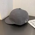 Detail shot of grey herringbone short brim baseball cap with devil face embroidery - Adjustable / Gray