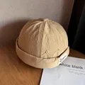 Detail der khakifarbenen Docker-Mütze mit Ripstop-Textur und seitlichem Webetikett - Verstellbar / Khaki