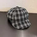 Detail van klassieke zwart-witte geruite baret met focus op textuur en stiksel - M (55-59cm) / Zwart