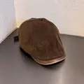 Detail of dark brown corduroy texture and leather brim on vintage flat cap - M (55-59cm) / Coffee