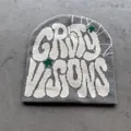 Detail of grey knitted beanie with white graffiti lettering and green star accents - One Size (52-59cm) / Gray