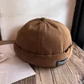 Detail of a brown cotton skull cap featuring the stitched Freedom letter patch design - Adjustable / Coffee