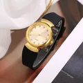 Elegant gold quartz watch with black silicone strap and crystal markers for women - Gold Dial Black Band