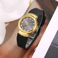 Macro view of crystal markers and golden case on women's quartz watch with black strap - Black Face Black Strap