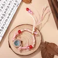 Ethnic woven beaded bracelet watch for women with mother-of-pearl dial and rose gold case - Green