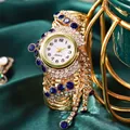 Luxurious gold vintage women watch with tassel and crystals on dark green satin - Blue Rhinestone
