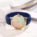 Detailed macro of a gold quartz watch featuring a vibrant rainbow gradient dial and blue strap - Blue