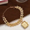 Detail of vintage gold square watch with unique I-shaped chain link strap and lobster clasp - Yellow
