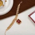 Detail of vintage square red dial watch with golden geometric hollow chain strap - Red