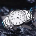 Macro shot of silver quartz watch with Roman numerals on a dark stone background - GD253 Roman Numeral White Dial
