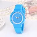 Close-up of a sky blue quartz watch with silicone strap on a refined decorative background - Blue