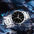Macro detail of men's Geneva watch with silver stainless strap on dark textured stone - GD253 Three Sub-dials Black Dial