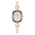 Detail of elegant oval rose gold watch with sparkling diamonds and white slim leather strap - Numeral White