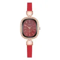Detailed close-up of oval rose gold watch case with crystal inlay and red leather strap - Number Red