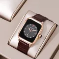 Detail of square rose gold watch with brown leather strap on a beige cushion display - Black Dial Wine Red Strap