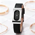 Detail of vintage rectangular quartz watch with silver case and black leather strap - Silver Case Black Dial Black Strap