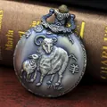 Close-up of vintage bronze zodiac pocket watch featuring a detailed ram relief carving - Sheep
