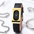 Detail of vintage rectangular gold watch with black oval dial and leather strap - Gold Case Black Dial Black Strap