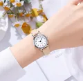 Detail of elegant ladies quartz watch with thin beige leather strap and white dial - Digit Khaki