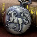 Detail of vintage bronze pocket watch featuring a horse relief and Chinese character - Horse