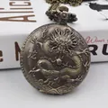 Macro shot of bronze dragon pocket watch cover with Chinese character carving and metal chain - Dragon