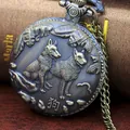 Macro shot of bronze zodiac pocket watch featuring a detailed relief of two hunting dogs - Dog