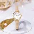 Detail of elegant gold case watch with Roman numeral dial and beige leather strap - Beige