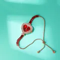 Dettaglio orologio a cuore con quadrante sfumato rosso e cinturino a scorrimento rosa - Oro Rosa Rosso
