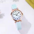 Detailed macro view of the light blue strap and rose gold case on the quartz watch - Silicone Strap (Tadi) / Blue