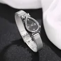 Macro view of teardrop watch face with crystal bezel and black minimalist dial - Diamond Face Black