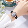 Close-up of elegant gradient dial watch with rose gold case and black leather strap - Silicone Strap (Tadi) / Black