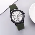 Detail of green silicone strap and black metal casing on this stylish quartz watch - Green