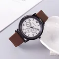 Detail view of OURSTART men's watch with brown silicone strap and multi-dial face - Brown