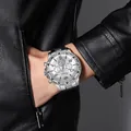 Close-up of a silver steel men's watch with white dial on a black leather jacket - All Silver