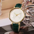 Close-up of a ladies' quartz watch featuring a 3D bow relief and green crocodile strap - Green